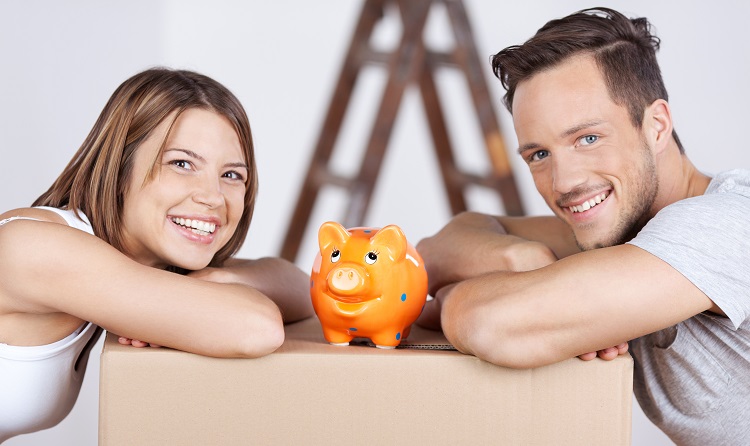 couple with piggy bank on box