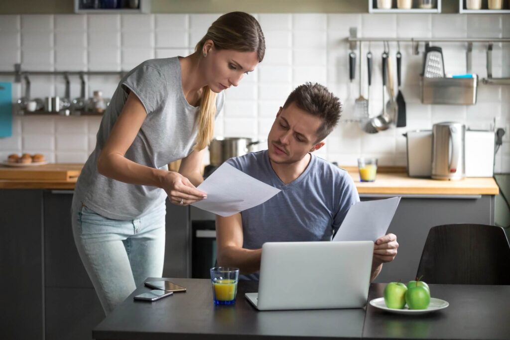 A couple looking at some papers