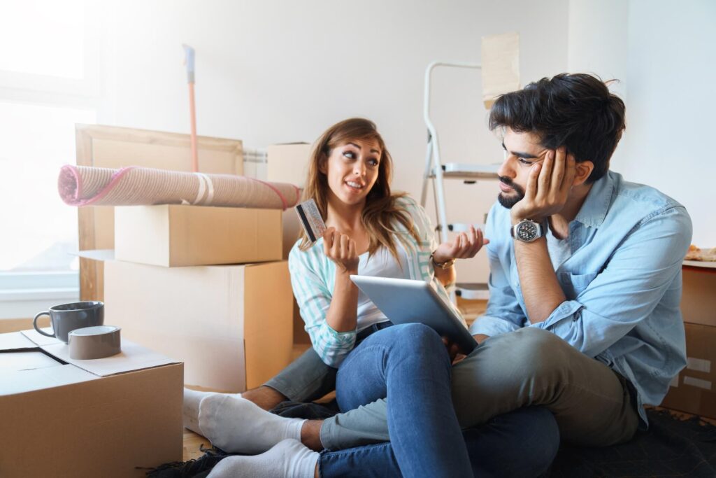 A couple looking over their finances before moving internationally