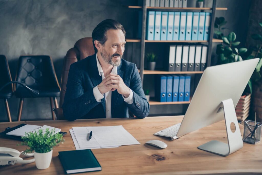 A man counseling someone online after moving overseas