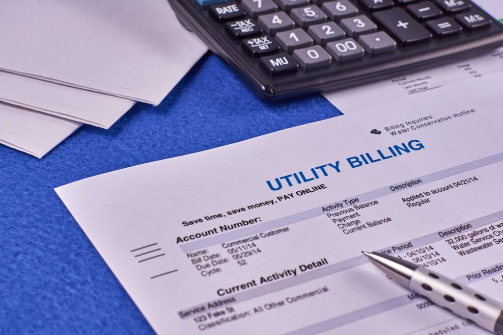 A paper for utility bills on a blue table