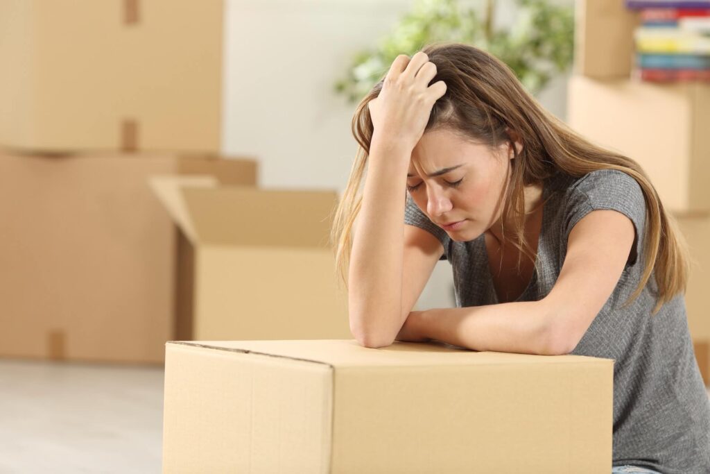 A worried woman before moving abroad