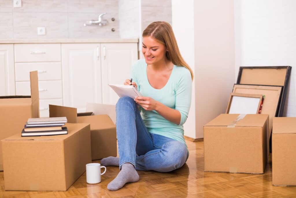 Girl organizing packing for moving overseas