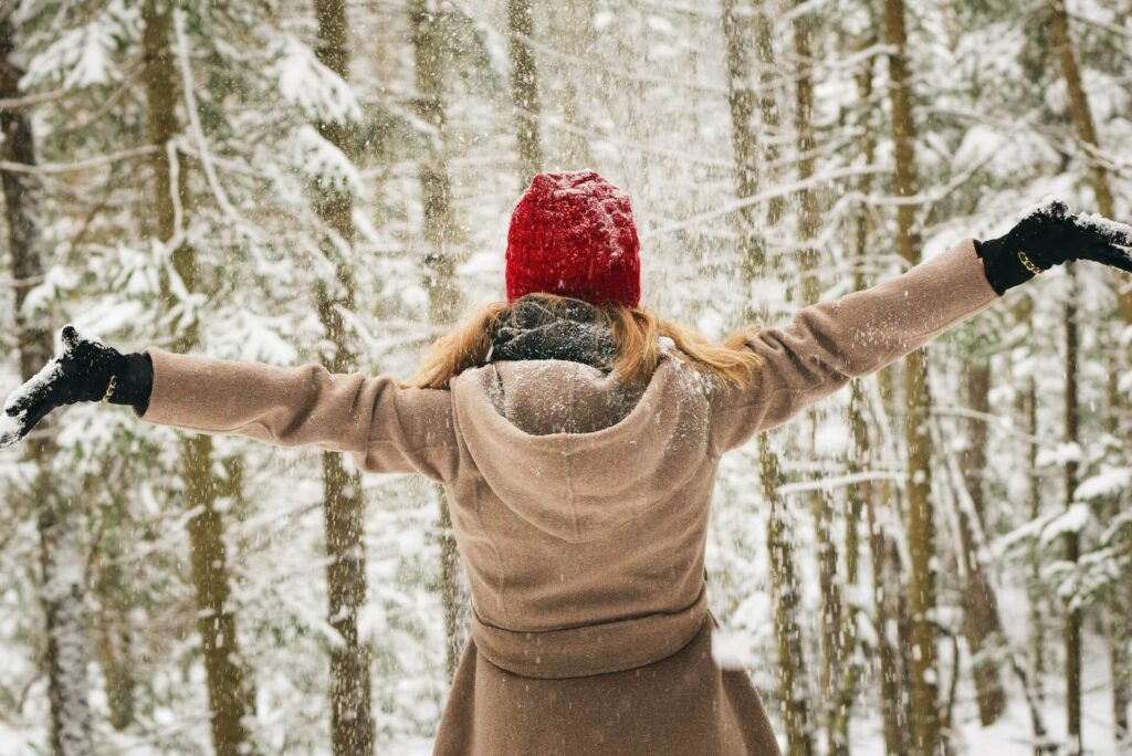 A woman in the forest with snow