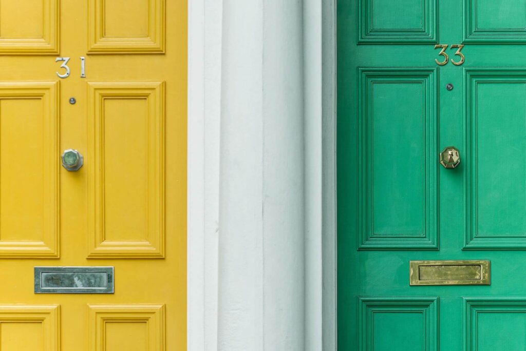 Green and yellow doors next to each other 