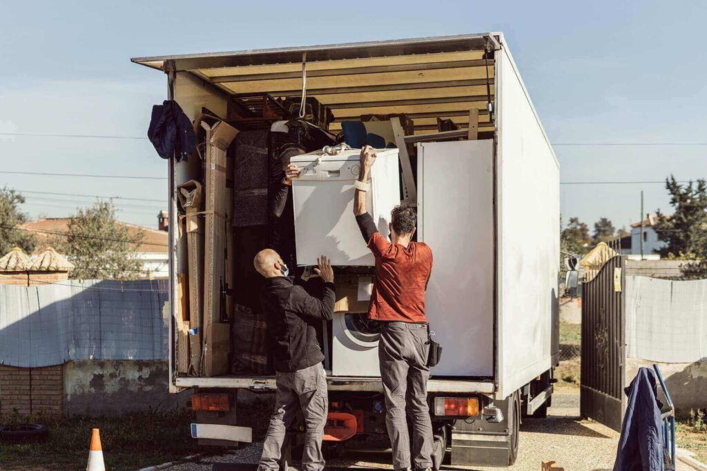 Men putting boxes in a truck