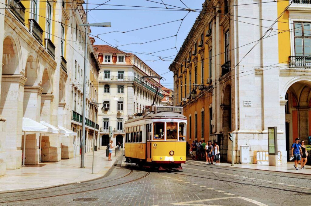 People exploring the streets of Lisbon after moving overseas