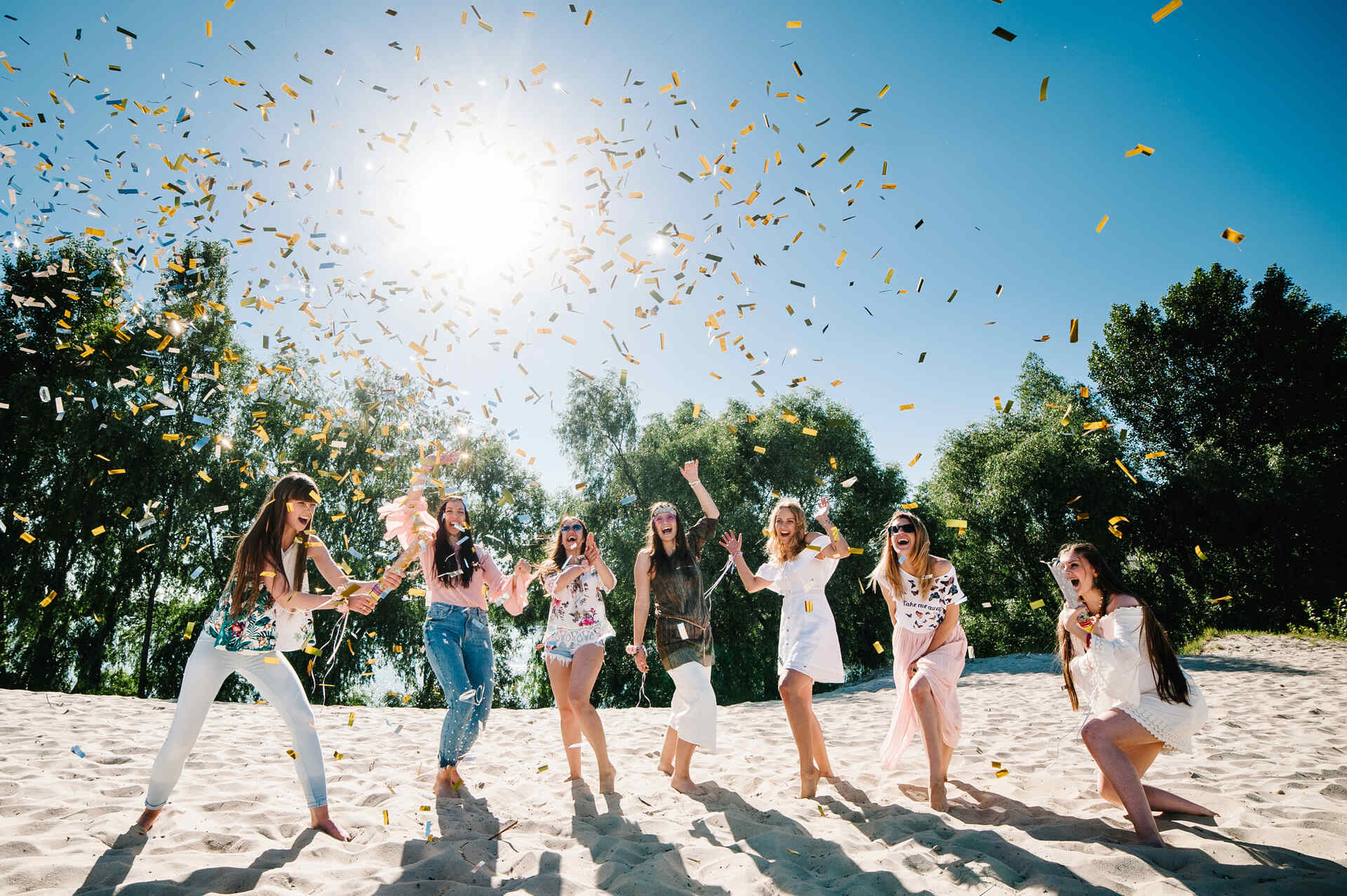 Girls celebrating on the beach before moving overseas